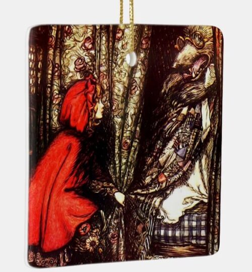 Square shaped ornament depicts Little Red Riding Hood peering past a curtain to reveal the Big Bad Wolf